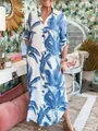 Women's blue tropical leaf print maxi shirt dress styled in a vibrant casual setting - White Base Blue Broad Leaf