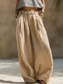 Vista detallada de pantalones anchos de lino para mujer con cintura elástica y bolsillos - S / Bottoms / Caqui