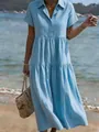 Detailed view of a light blue tiered shirt dress with lapel collar and short sleeves. - S / Sky Blue