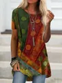 Detail of women's loose short sleeve T-shirt with vibrant digital geometric print - Orange