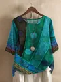 Detail view of bohemian style loose tunic with vibrant digital geometric circle print. - S / Tops / Green