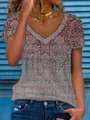 Dettaglio di una maglia ampia con scollo a V da donna con stampa floreale vintage. - Taglia S / Top / Rosso