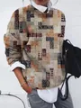 Détail d'un sweat-shirt ample à manches longues pour femmes avec imprimé tribal géométrique - S / Hauts / Imprimé Tribal Orange