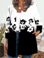 Close-up of the black and white floral print detail on a women's long sleeve jacket. - M / Top (9440) / Black and White Floral Print