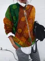 Primo piano dei vivaci motivi tribali geometrici su un cardigan spazzolato a maniche lunghe - Taglia S / Top (9434) / Pois Verde Scuro Arancione (Foto 8)