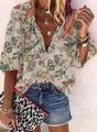 Close-up detail of women's vintage bohemian floral print shirt with bird motifs and buttons - S / Tops / Grey Floral Bird Print