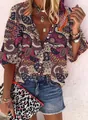 Close-up of vintage paisley print shirt with V-neck and button detailing for women - S / Tops / Beige Paisley Floral Print