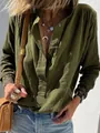 Close-up of olive green cotton linen shirt with textured fabric and button detail - S / Tops / Green
