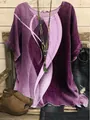 Close-up of women's loose purple tunic with abstract wave print on a rustic background - S / Tops / Purple (Abstract Wave Print - Fig 31)