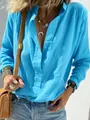 Close-up of casual blue cotton linen long-sleeve shirt with vintage button details - Lake Blue