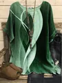 Detailed view of women's loose green round neck top with abstract leaf print design - S / Tops / Vintage Green Abstract Print (Image 22)