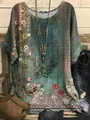 Detailed view of the vintage floral and scroll print on a green casual loose top for women - S / Tops / Vintage Green Floral (Image 37)