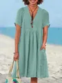 Detail view of a light green cotton linen V-neck summer dress with pleated waistline - S / Top And Bottom / Light Green
