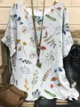 Detailed view of women's casual loose short-sleeved top with colorful botanical prints - S / Tops / White Colorful Floral (Image 38)