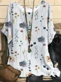 Detail of women's casual floral print short sleeve blouse with round neck and loose fit - S / Tops / Light Blue Ditsy Floral (Image 39)