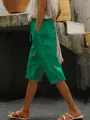 Gedetailleerd zijaanzicht van groene katoenen linnen kuitbroek met handige zakken - S / Bottoms / Groen