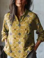 Close-up of mustard yellow floral long-sleeve blouse with button pocket detail. - S / Tops / Mustard Yellow Vintage Floral