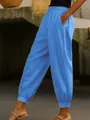 Vue latérale d'un jogging bleu en coton et lin pour femme avec poches latérales. - S / Bas / Bleu