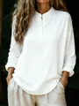 Detailed view of a loose white long-sleeve henley shirt for women with soft texture. - S / Tops / White