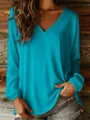 Detailed view of vibrant cyan loose V-neck long sleeve blouse with gathered cuffs - S / Tops / Teal