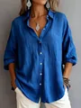 Close-up of a royal blue long-sleeve button-down shirt featuring a textured fabric - Blue