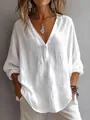 Close-up detail of a white v-neck long sleeve loose linen-style blouse for women - S / Tops / White