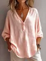 Detailed view of a stylish pink V-neck loose fit shirt featuring unique textured fabric - S / Tops / Pink