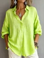 Detail view of the lime green oversized button-down shirt with textured fabric. - Yellow-Green