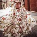 Dettaglio dell'abito maxi bohémien floreale con cintura in pelle e borsetta coordinata - Taglia S / Top / Stampato