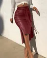 Side view of wine red PU leather midi skirt with buttons and high waist slit detail - S / Bottoms / Burgundy