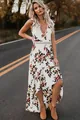 Robe longue bohème sans manches col en V, imprimé fleuri avec ourlet asymétrique pour look d'été chic - Blanc