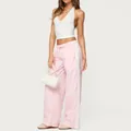 Vista dettagliata dei pantaloni della tuta rosa larghi da donna con strisce laterali - Taglia S / Pantaloni e gonne / Colore loto