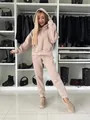 Macro detail of beige fleece hooded sweatshirt and jogger pants set worn by female model. - S / Top And Bottom / Apricot
