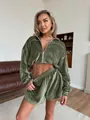 Close-up of olive green velour two-piece set with zip-up jacket and shorts - S / Top And Bottom / Army Green