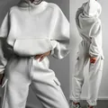 Front and back detail views of a white oversized hoodie and matching cargo jogger pants - White