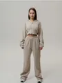 Detail view of a beige zip-up hooded sweatshirt and matching wide-leg lounge pants - S / Top And Bottom / Khaki