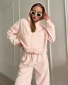 Detailed view of women's pink 2-piece sports set with zipper hoodie and sweatpants - S / Top And Bottom / Pink