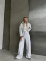 Grey two-piece tracksuit for women featuring a zip-up hoodie and wide-leg pants - Light Gray