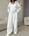 Detail view of a women's light grey hooded zip-up tracksuit with wide-leg pants - S / Top And Bottom / Light Gray