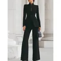 Elegant zwart tweedelig pak met blazer met één knoop en uitlopende broek met wijde pijpen. - S / Boven- En Onderstuk / Zwart