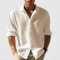 Detail view of men's white waffle knit long sleeve casual button down shirt texture. - Apricot
