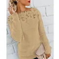 Detail shot of the delicate floral lace cutout neckline on a beige long sleeve knit sweater - S / Tops / Khaki