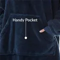Close-up of the large kangaroo pocket on a navy blue oversized fleece hoodie blanket. - One Size / Tops / Navy Blue