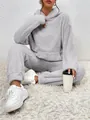 Close-up showing the soft grey teddy fleece fabric and pocket detail of the loungewear set - XS / Top And Bottom / Gray