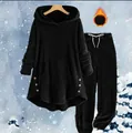 Close-up of black fleece hoodie and jogger set designed for winter warmth and comfort. - Black