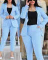 Close-up detail view of a stylish light blue professional women's blazer and pantsuit set - S / Top And Bottom / Sky Blue
