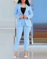 Detailed shot of a light blue women's professional suit with double-breasted blazer - S / Top And Bottom / Sky Blue
