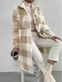 Detailed view of women's long plaid sherpa coat with soft fleece texture and lapel. - Apricot And White Plaid