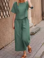 Full view of casual green linen two-piece set worn by model on outdoor sidewalk - XS / Top And Bottom (Short Sleeve) / Dark Green