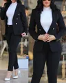 Detail view of women's professional black blazer and pants suit with gold buttons. - S / Top And Bottom / Black